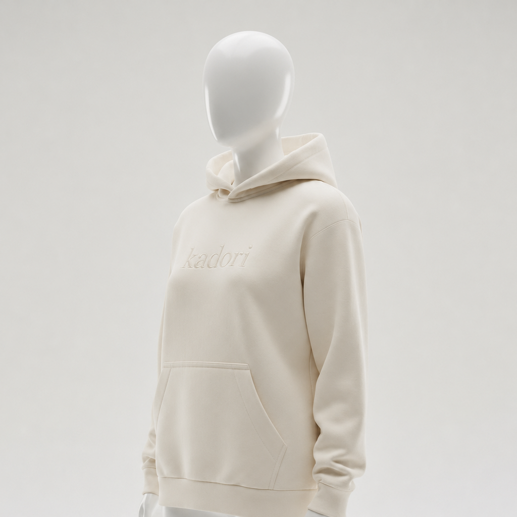 White hoodie on a mannequin against a light gray background